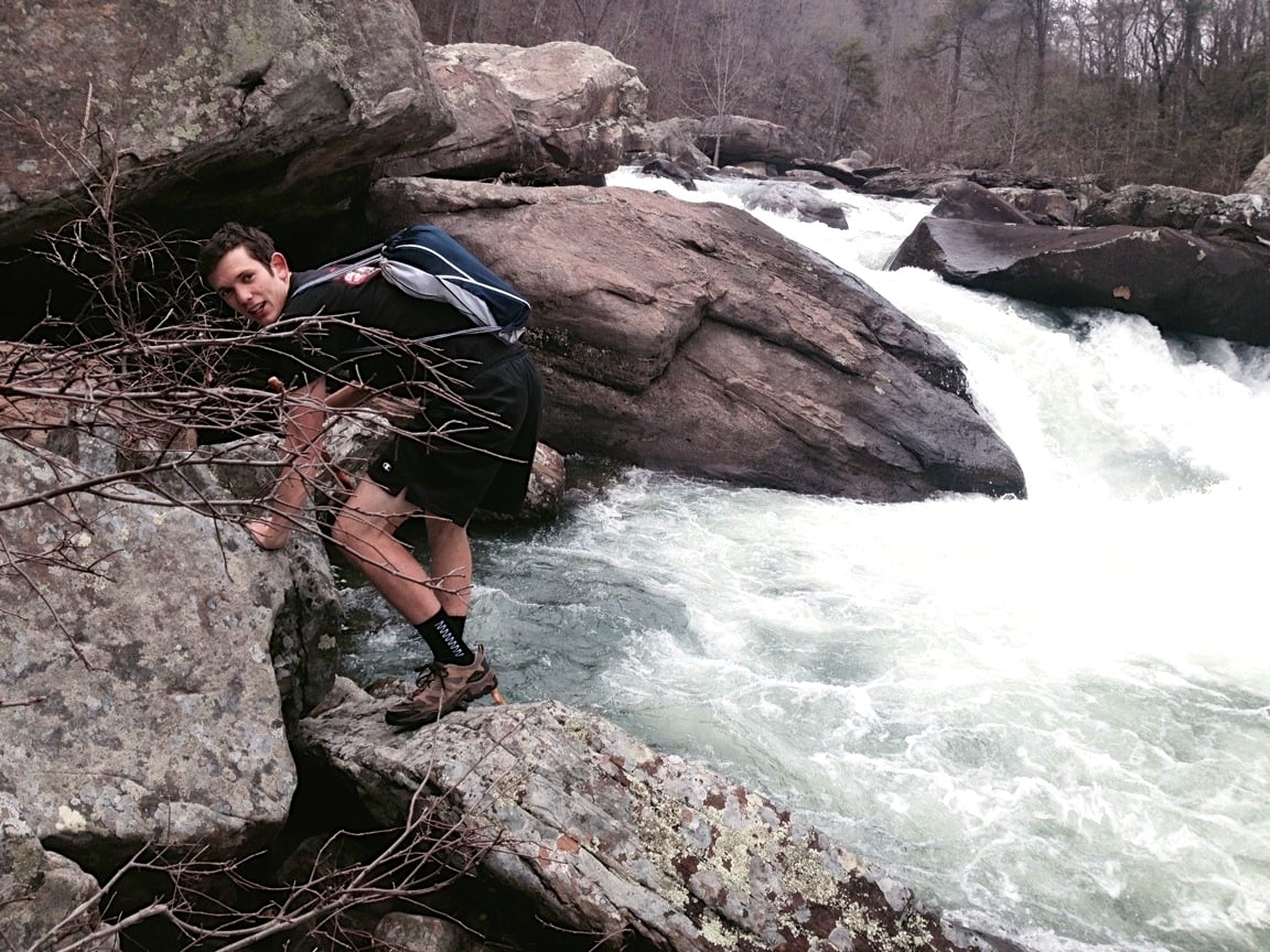 Ben Gilbreath climbs along the bank of boulders in Little River Canyon.